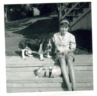 An early family photograph of Suzanne Howell with dogs